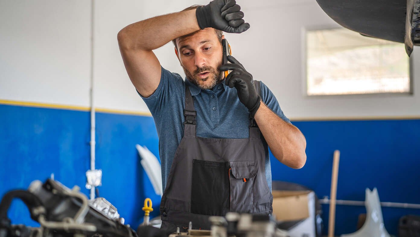 Mechanic Exhausted After Long Day of Making Up Fake Car Parts That Need To Be Fixed