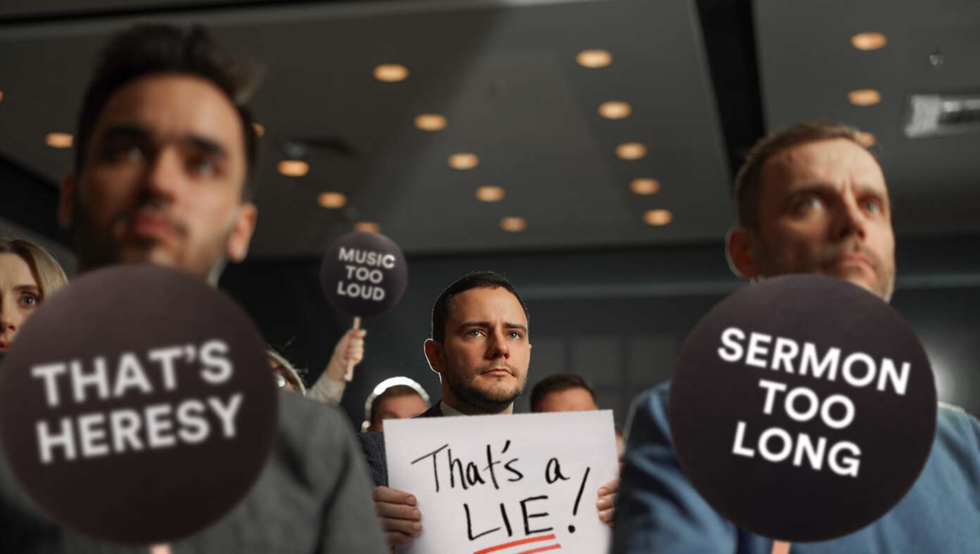 Disgruntled Churchgoers Hold Up Protest Paddles