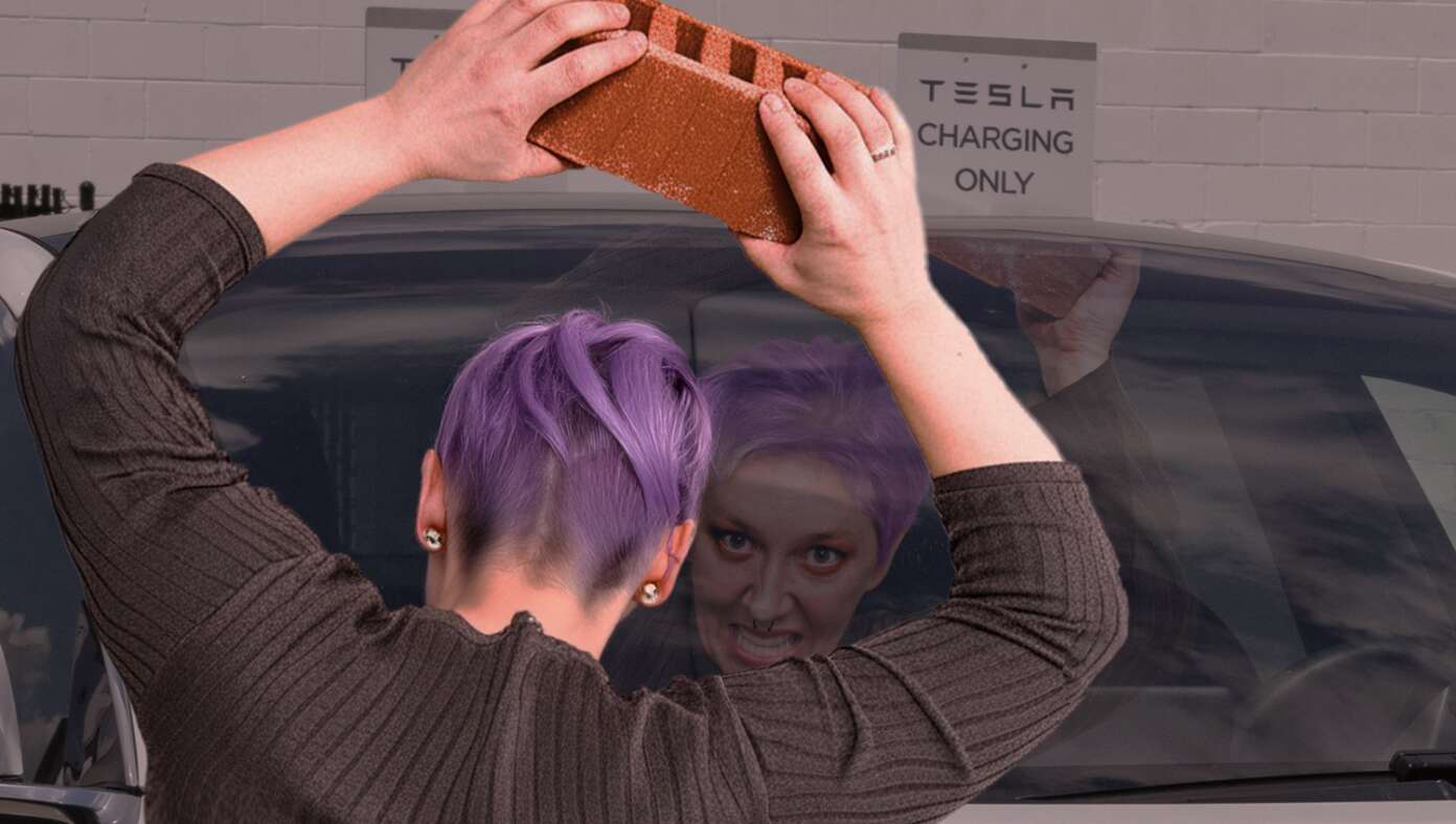 Leftist Smashes Tesla After Seeing Terrifying Image Of Fascist In Window