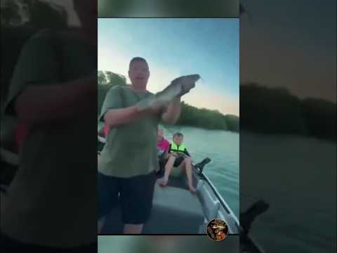 This guy sees an eagle eyeing the fish he just caught—and…