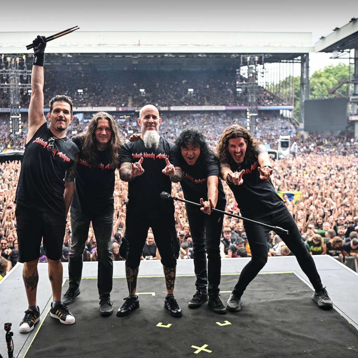 members of us rock band anthrax pose for a photo after playing as a support act during british rock band black sabbaths back to the beginning concert ozzy osbournes final ever gig as black sabbat
