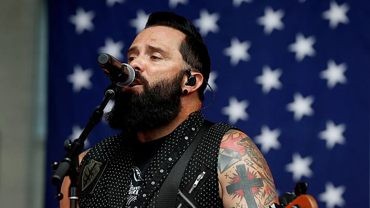 John Cooper Still Clinging To Skillet’s Christian Roots Because The Paycheck Is Still Good